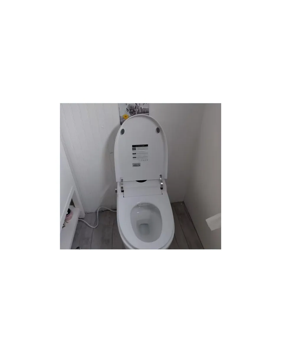 FlowLux smart toilet — Gucci-tile bathroom